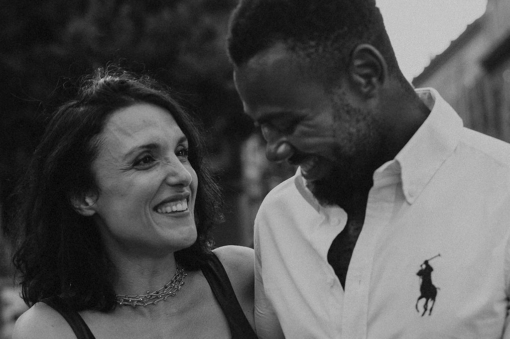 Insterracial couple laughing in Trastevere