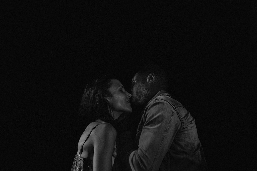 interracial couple cuddling, black and white