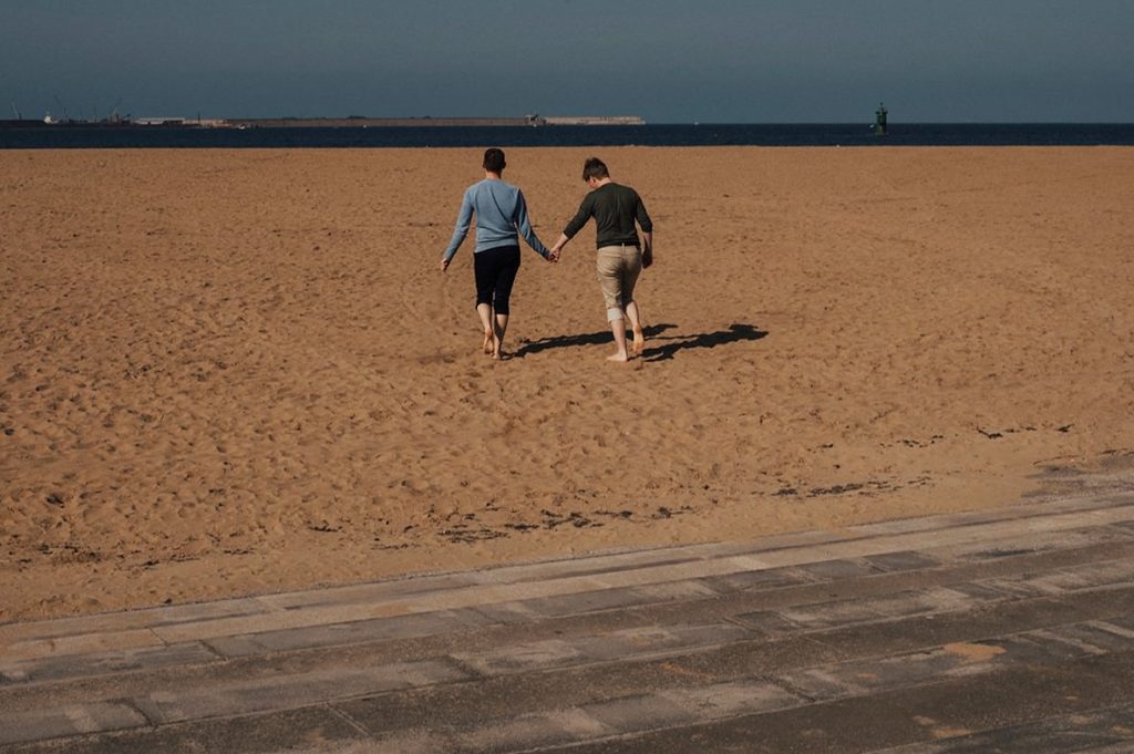 couple running on the beach