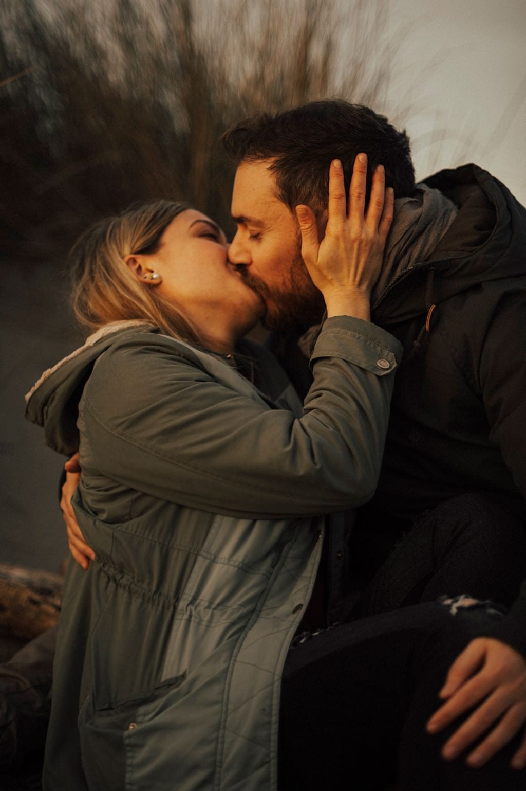 portrait of couple kissing in the nature